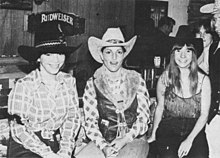 Roberta Williams and her two colleagues all wearing cowboy hats