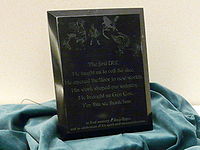 A plaque dedicated to Gary Gygax at Gen Con 2008 reading: 